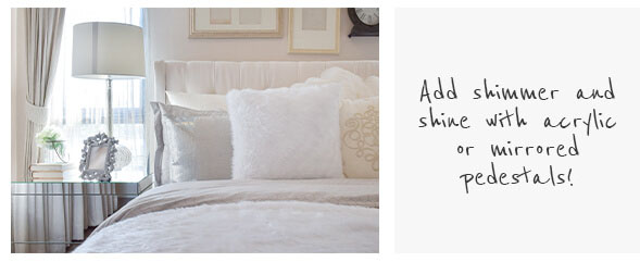white bedroom interiors, white bedding and white lamps on a mirrored bedside table and acrylic bedside table